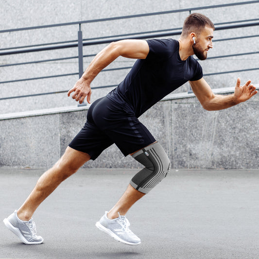 A Man Running With A Knee Sleeve 