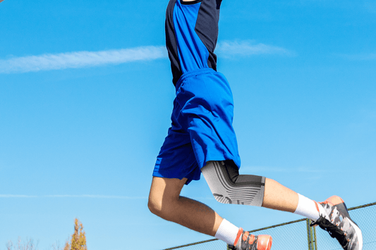 A Basketballer Wearing A Grey Knee Brace When Playing Game