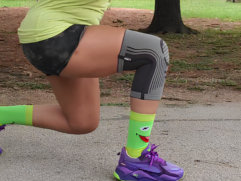 A Girl Warming-up with the Suitable Knee Sleeve